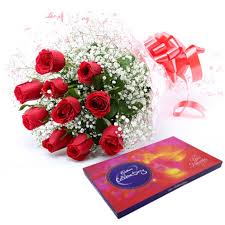 12 red roses bouquet with Cadburys celebration box
